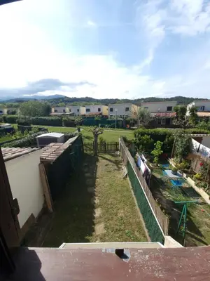 a view from the balcony of a house with a yard at Villa Frati in Poggio-Mezzana
