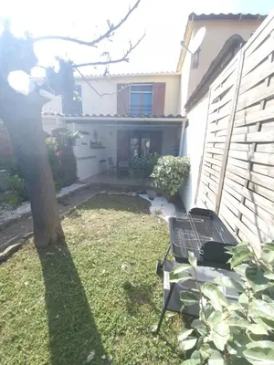 a backyard of a house with a bench in the yard at Villa Frati in Poggio-Mezzana