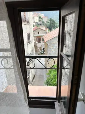 a view from a window of a city street at HÖTEL U SANTA MARIA in Olmeto