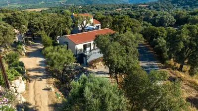 an aerial view of a house on a dirt road at Casa Léa in Sollacaro