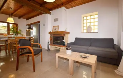 a living room with a couch and a table at 2 Bedroom Stunning Home In Popolasca in Popolasca