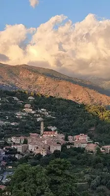 a view of a city with a mountain in the background at Mare e Monti Chez Thomas et Magali in Vico