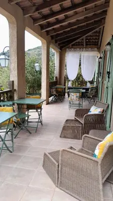 an outdoor patio with tables and chairs and tables at Mare e Monti Chez Thomas et Magali in Vico