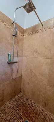 a shower with a shower head in a bathroom at Bergerie A Sapara in Pianottoli-Caldarello