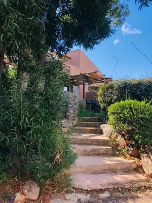 a set of stone steps leading to a house at E Casette Di Santa Giulia in Porto-Vecchio