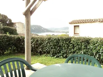 a table and two chairs sitting at a table at E Casette Di Santa Giulia in Porto-Vecchio