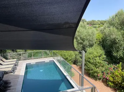 an overhead view of a swimming pool in a house at Villa La Rondina vue mer, piscine et plage à pied. in Zonza