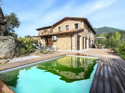an old stone house with a pool in front of it at Holiday Home Mela by Interhome in Sotta