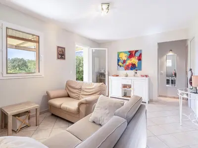 a living room with a couch and a table at Holiday Home A Vigna by Interhome in Sotta