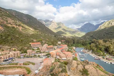 a town in a valley with a river and mountains at Appartement T2 Porto in Porto Ota