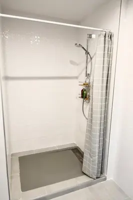 a shower in a bathroom with a glass door at Appartement 60m2 avec piscine privée dans villa in Oletta