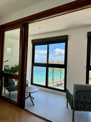 a living room with a view of the ocean at Hyper Centre, Front De Mer in Ajaccio