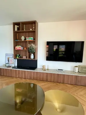 a living room with a large flat screen tv on a wall at Hyper Centre, Front De Mer in Ajaccio