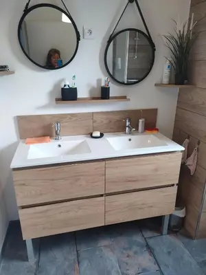 a bathroom with a sink and two mirrors at Sartène Appartement 3 pièces vue mer avec jardin in Sartène