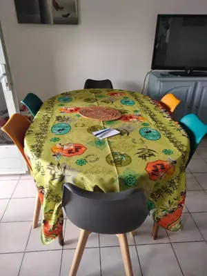 a table with a table cloth on top of it at Sartène Appartement 3 pièces vue mer avec jardin in Sartène