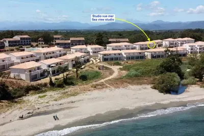 an aerial view of a resort on the beach at Studio 2 personnes vue mer et pieds dans l'eau in Linguizzetta