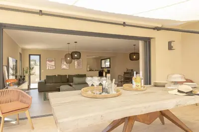 a living room with a table with wine glasses on it at Villa Vignarella in Sorbo-Ocagnano