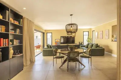 a living room with a table and a couch at Villa Vignarella in Sorbo-Ocagnano