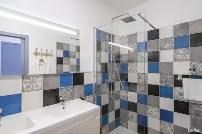 a bathroom with a sink and a mirror at Résidence CasaBianca Porticcio - Nino in Grosseto-Prugna