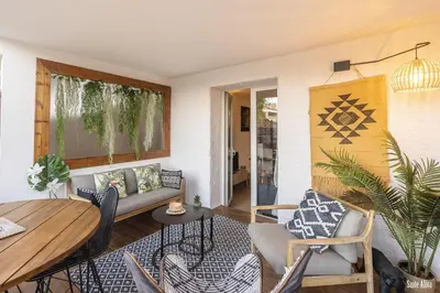 a living room with a couch and a table at Résidence CasaBianca Porticcio - Aliva in Porticcio