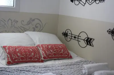 a bedroom with two red pillows on a bed at Résidence CasaBianca Porticcio - Paomia in Porticcio