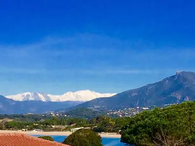 a view of a mountain range with snow covered mountains at Résidence CasaBianca Porticcio - Roccapina in Porticcio