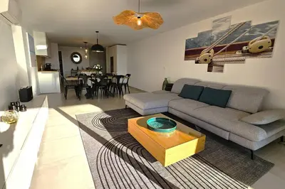 a living room with a couch and a table at Nouveau Superbe appartement - Rsd Calypso Tiuccia in Casaglione