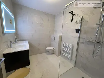 a bathroom with a shower and a toilet and a sink at Bonifacio Les Jardins secrets de Piale in Bonifacio