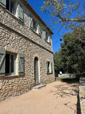 a large stone building with windows on the side of it at Château Balesi Bonifacio in Bonifacio