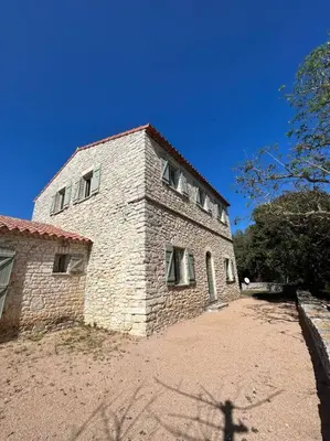 a brick building with windows on the side of it at Château Balesi Bonifacio in Bonifacio