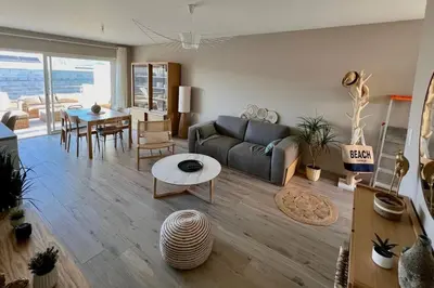 a living room with a couch and a table at joli T4 centre ville Porticcio in Grosseto-Prugna