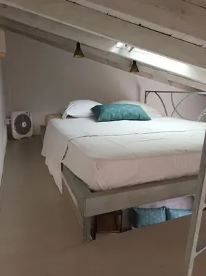 a bunk bed in a room with at Casaluna, centre village, joli petit studio in Sotta