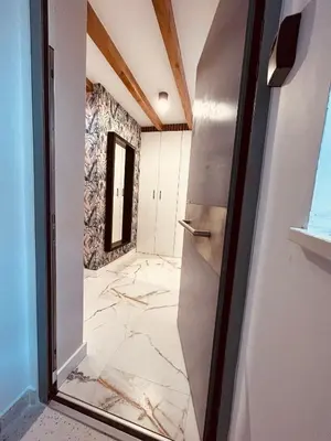 a room with a marble floor and a door at Appartement au centre du Port de Bonifacio in Bonifacio
