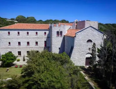 a large stone building on top of a hill at Domaine du Couvent de Saint Julien in Bonifacio