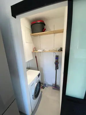 a laundry room with a washer and a washing machine at Maison neuve Porto Vecchio in Porto-Vecchio