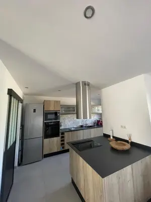 a kitchen with a sink and a counter top at Maison neuve Porto Vecchio in Porto-Vecchio