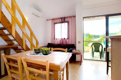 a swimming pool with a view of the water at Appartement charmant avec piscine à Porticcio - 32 m² in Porticcio