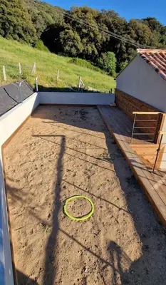 a backyard with a hula hoop in the dirt at Belle villa à la campagne dans un coin cosy in Sartène