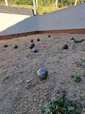 a bunch of balls sitting on the ground at Belle villa à la campagne dans un coin cosy in Sartène