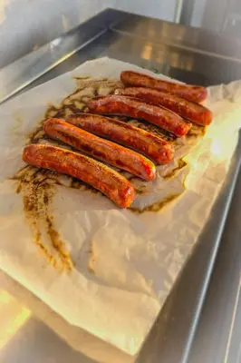a group of sausages sitting on a piece of paper at Fiori Di Cala Rossa, Établissement CARDOGA Piscine, Mer & Montagne in Lecci