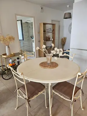 a dining room with a table and chairs at ajaccio Sanguinaires in Ajaccio