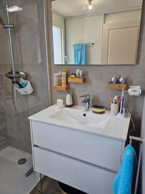a bathroom with a white sink and a shower at ajaccio Sanguinaires in Ajaccio