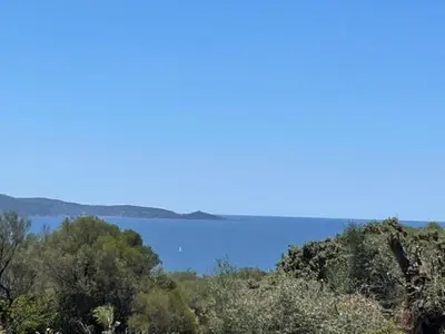 a view of a body of water from a hill at VILLA A MUREDDA, piscine chauffée et vue mer in Olmeto
