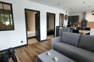 a living room with a couch and a kitchen at T3 - 100m du port in Propriano