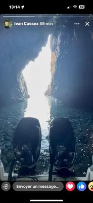 a television screen with two chairs in front of a cave at T3 - 100m du port in Propriano