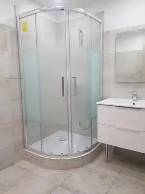 a bathroom with a shower and a sink at Maison T2 500m de la plage in Poggio-Mezzana