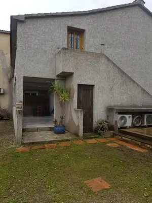 a house with a door and a window and a house at Maison T2 500m de la plage in Poggio-Mezzana