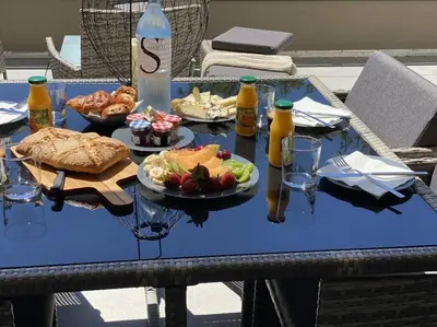 a table with food and drinks on top at Appartement 4 personnes - Grande terrasse - Proche du Port - Porto-Vecchio in Porto-Vecchio
