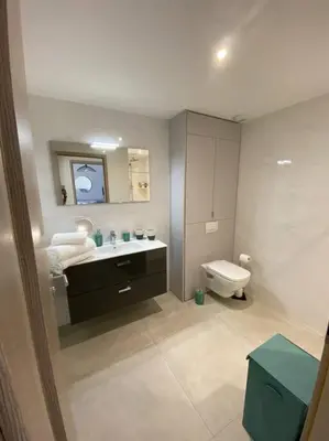 a bathroom with a sink and a toilet at Appartement 4 personnes - Grande terrasse - Proche du Port - Porto-Vecchio in Porto-Vecchio