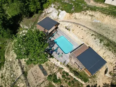 an aerial view of a house with a swimming pool at Chalet U Pinu in Venaco